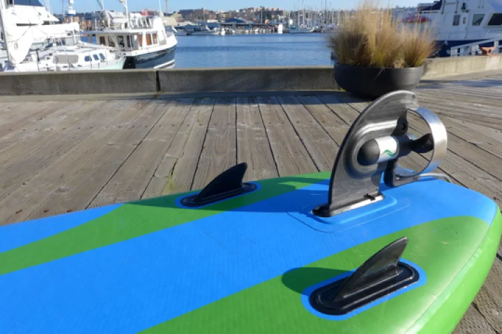 The motorized ElectraFin slides into the existing fin box on stand-up paddleboards