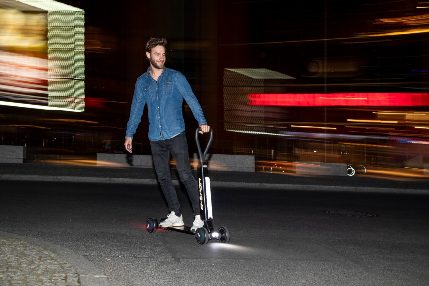 The Audi e-tron Scooter has a range of 20 km per charge, and a top speed of 20 km/h