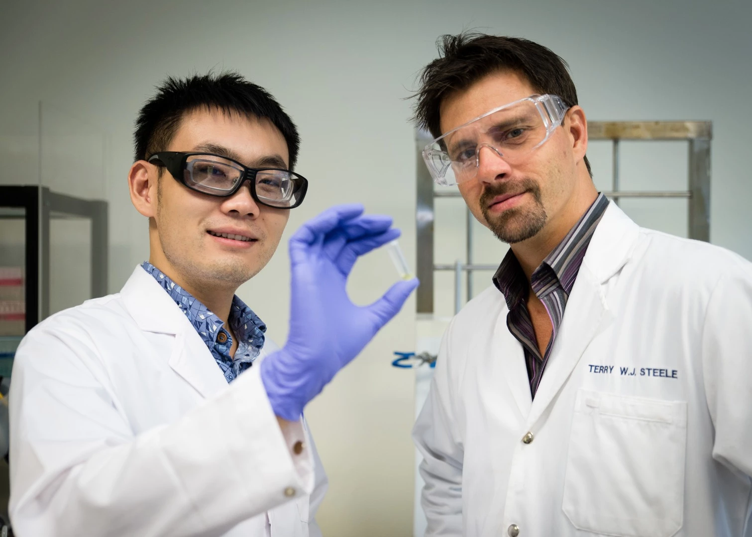NTU Asst Prof Terry Steele (right) with his researcher Gao Feng have developed a glue that hardens when an electrical voltage is applied