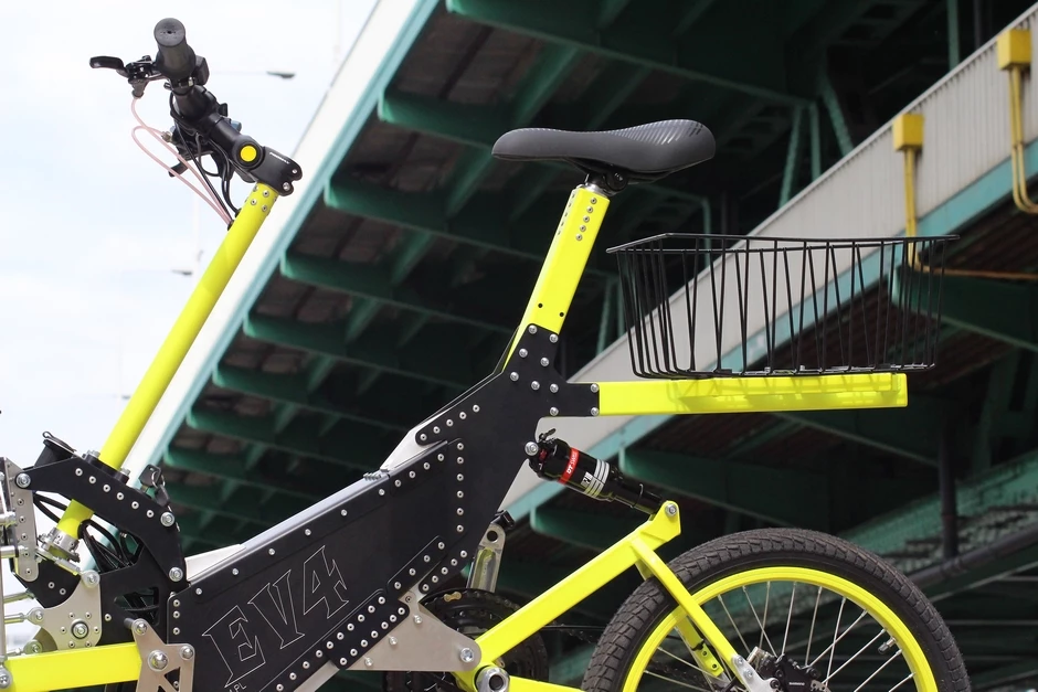 Lots of rivets, bolts and metal sheeting attached to the e-trike's aluminum frame