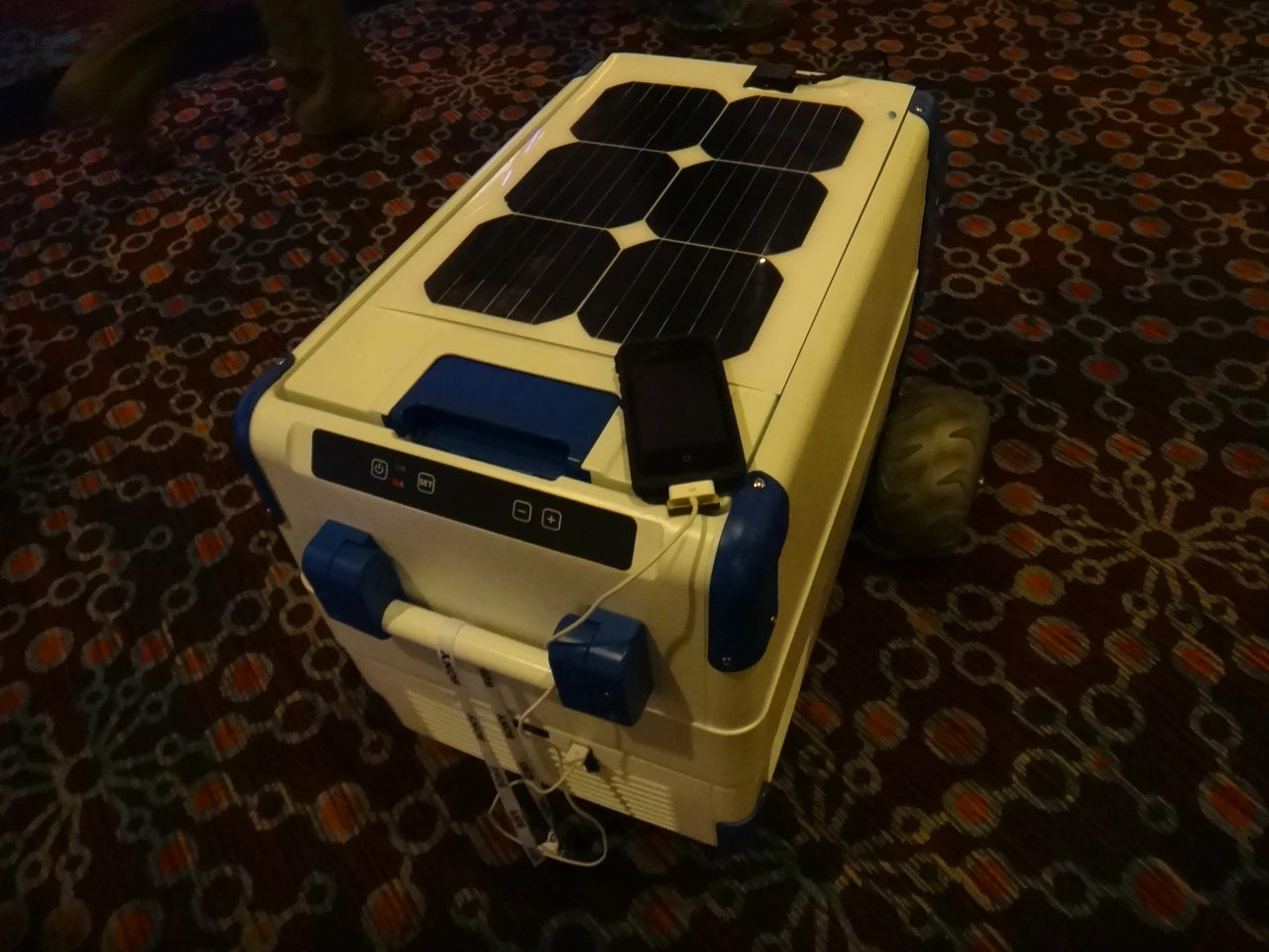 The Solar Cooler, as its name implies, is a portable container for food and drinks that keeps its contents cold using a compact refrigeration system connected to solar panels