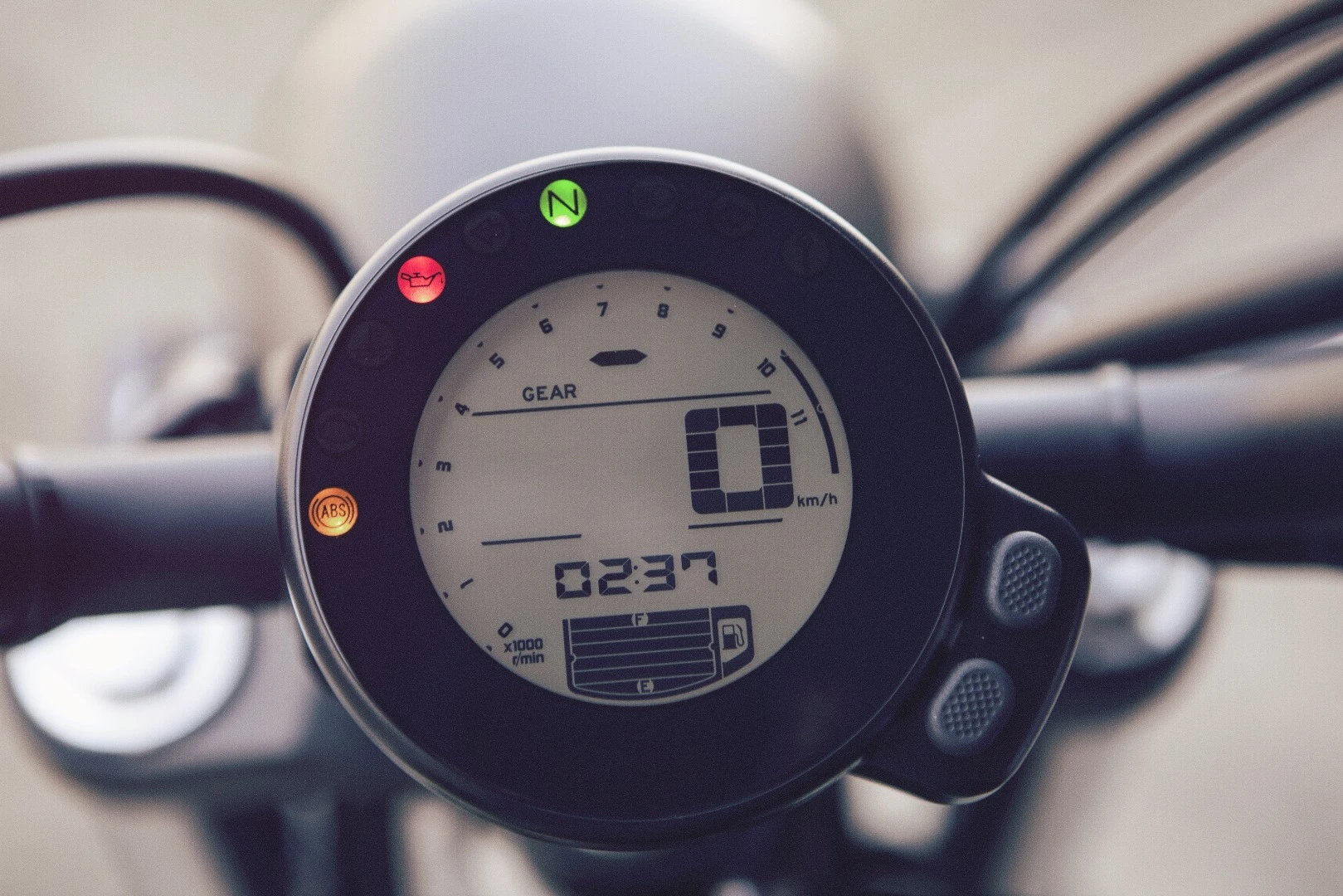 The round digital instrument resembles slightly the relevant part of the Ducati Scrambler