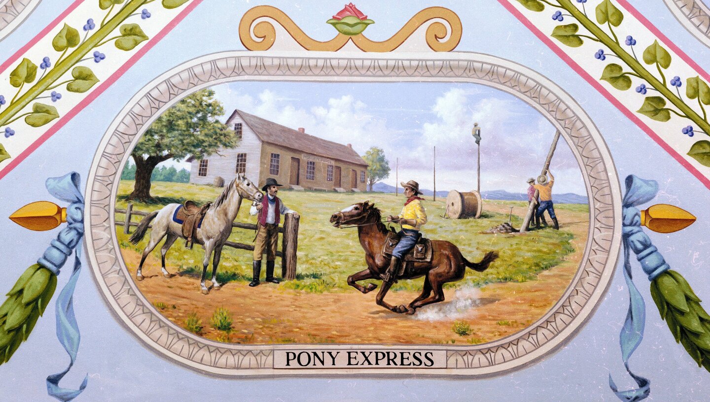 A modern painting of a Pony Express station where two riders are passing the mail on, while the transcontinental telegraph is being erected by the road (Photo: Architect of the Capital)