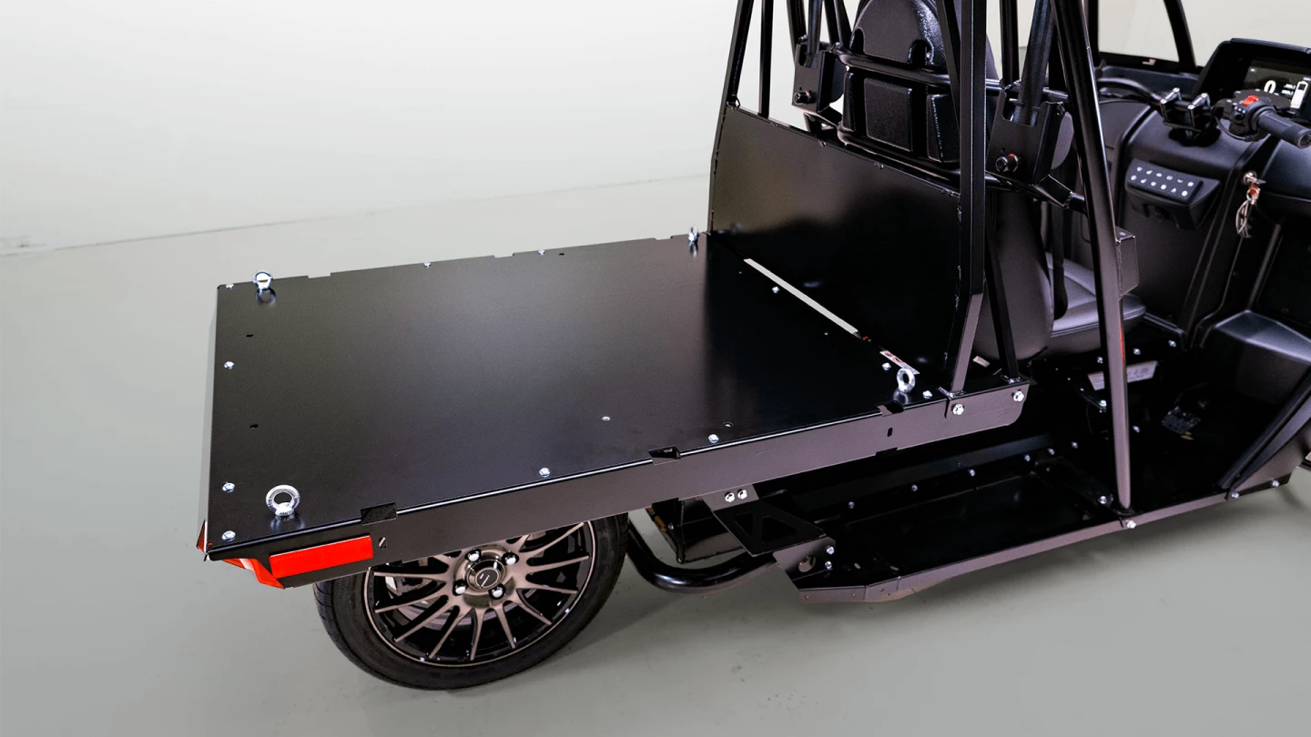 The base Modular Utility Vehicle features an open flat bed with a deck height of 28 inches, and can also be configured with a pickup bed package