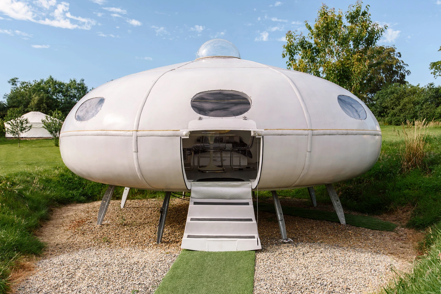 The UFO 'Futuro styled Flying Saucer' sleeps up to four people in Wales, UK. Its interior features a monitor for playing classic video games – naturally Space Invaders is included