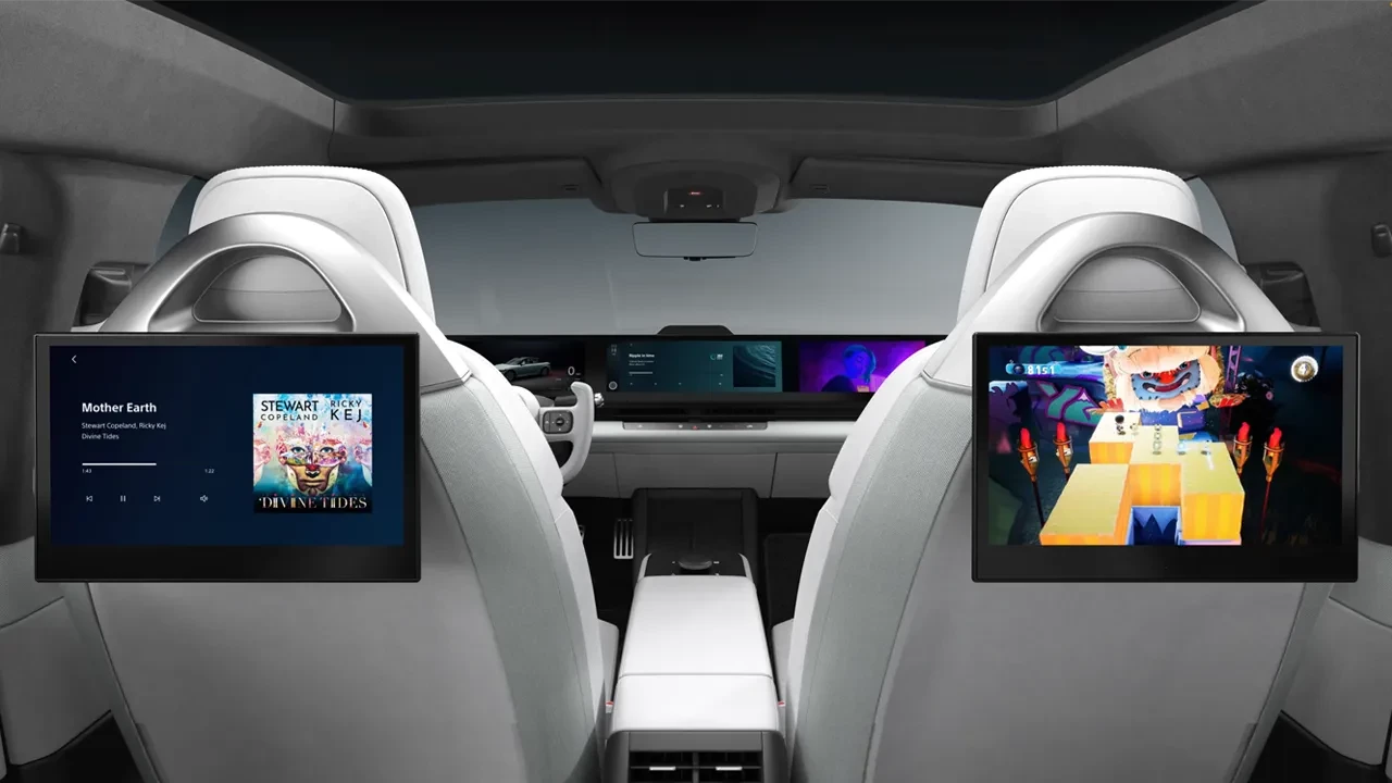 Individual screens are positioned on the back of each seat for in-car entertainment