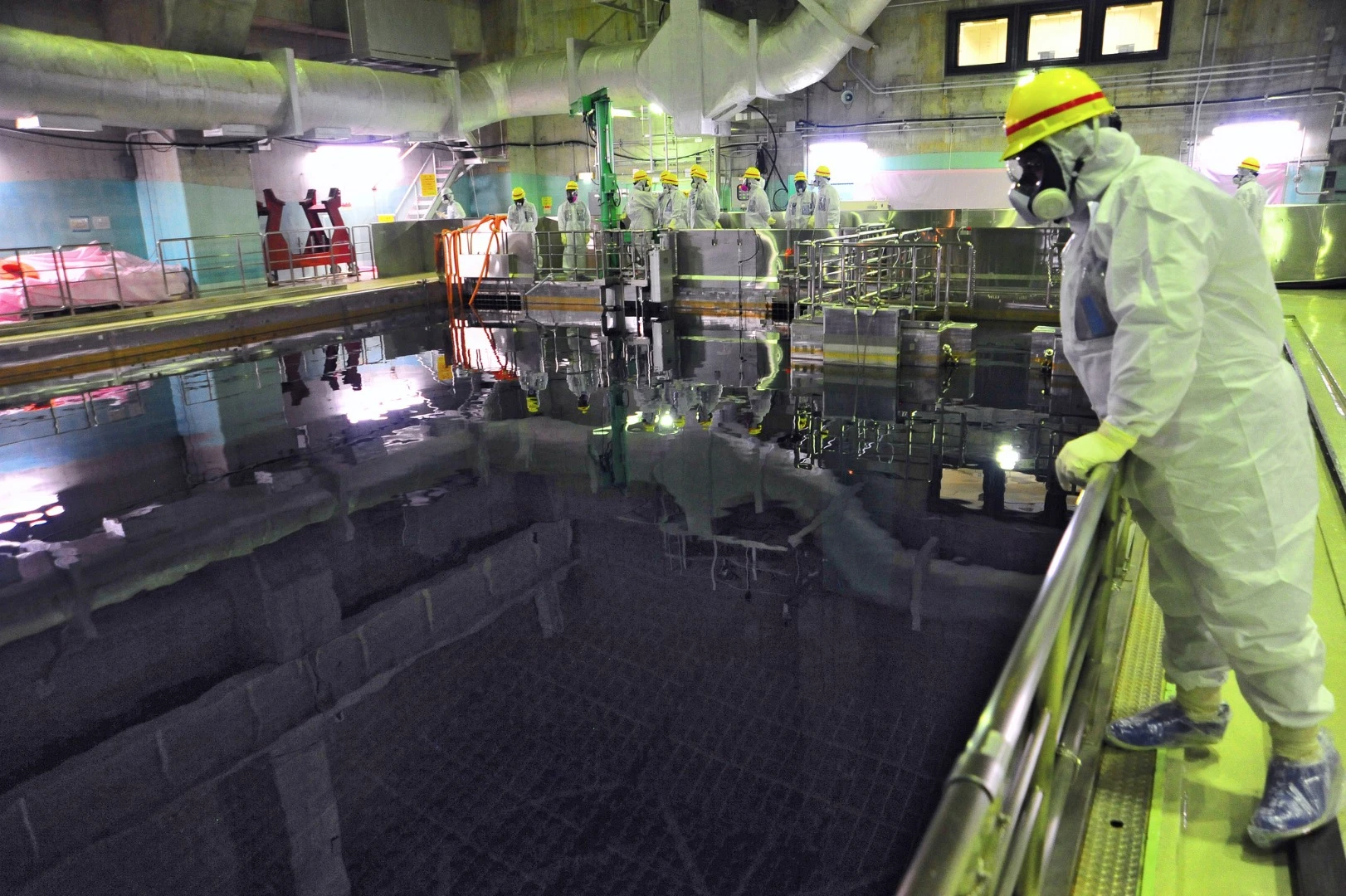 Experts from the International Atomic Energy Agency inspect a spent fuel pool at the Fukushima Daiichi nuclear power plant