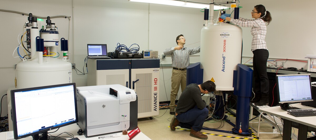 Researchers in the NMR lab, which helped prove experimentally that the new material was an effective conductor of magnesium ions