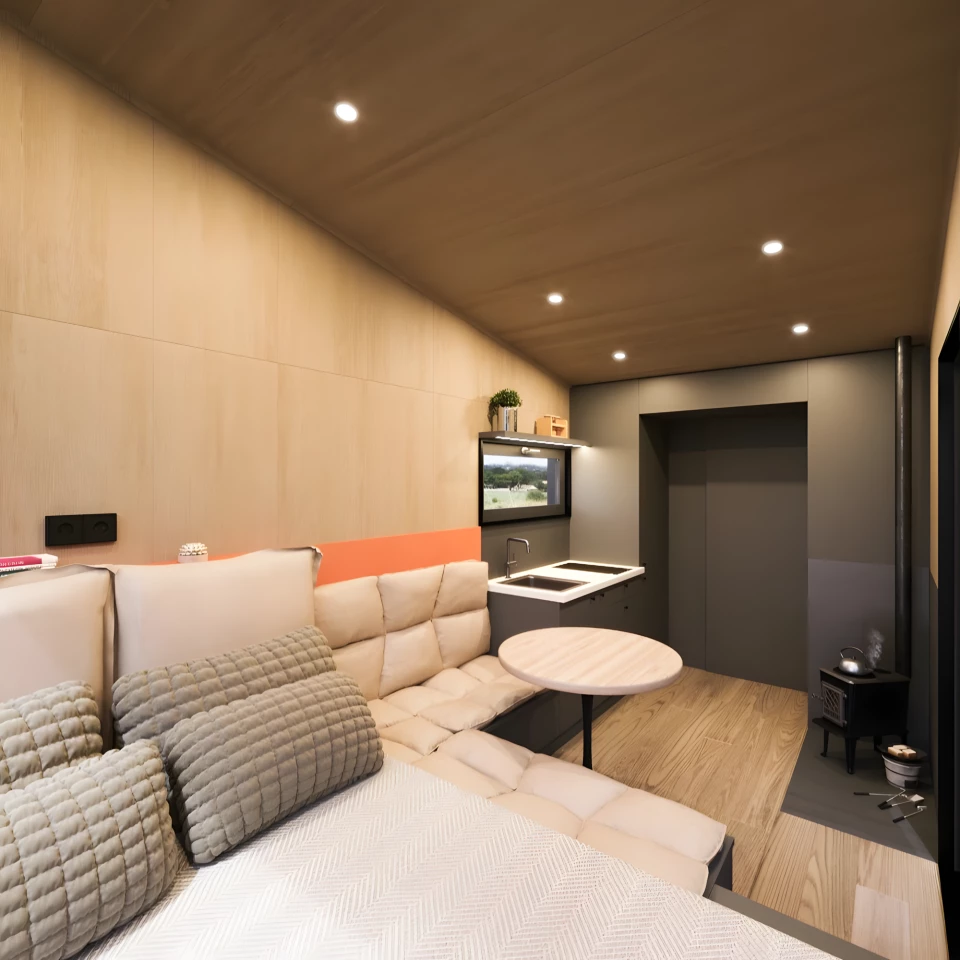 The Ambra includes a double bed and a small seating area, plus a dining table