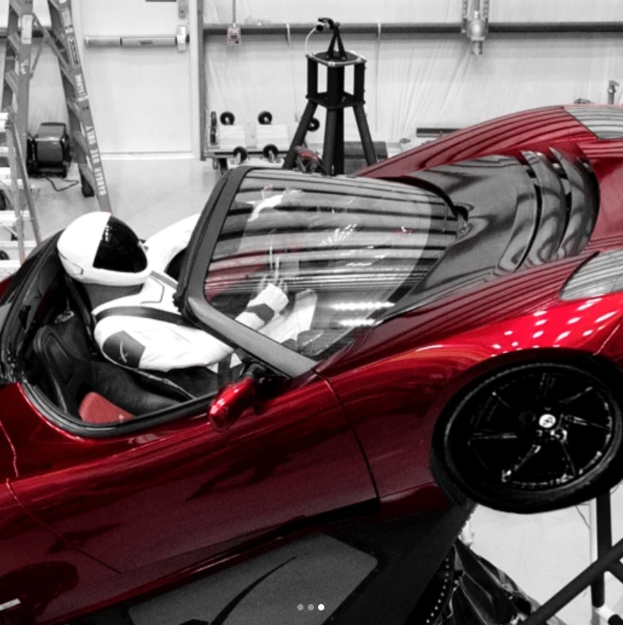 A dummy sits in Elon Musk's Tesla Roadster, headed for Mars
