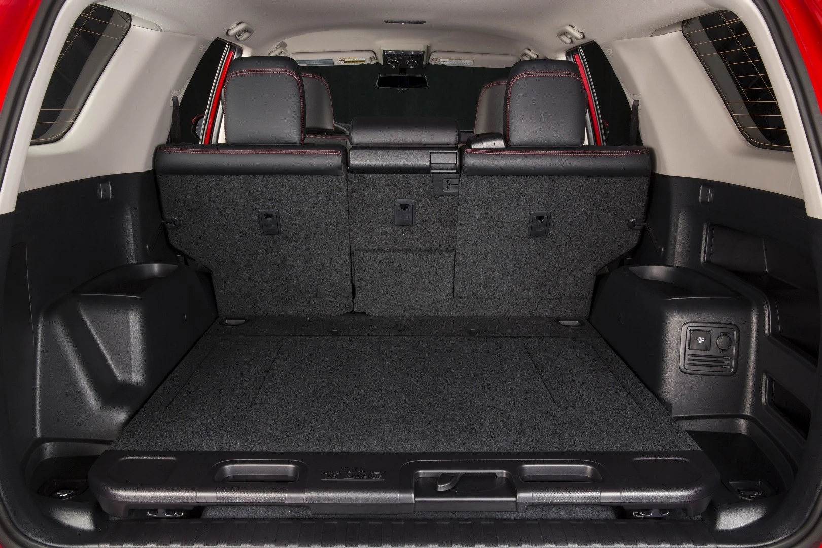 The sliding cargo deck retracts into place and serves as a flat floor