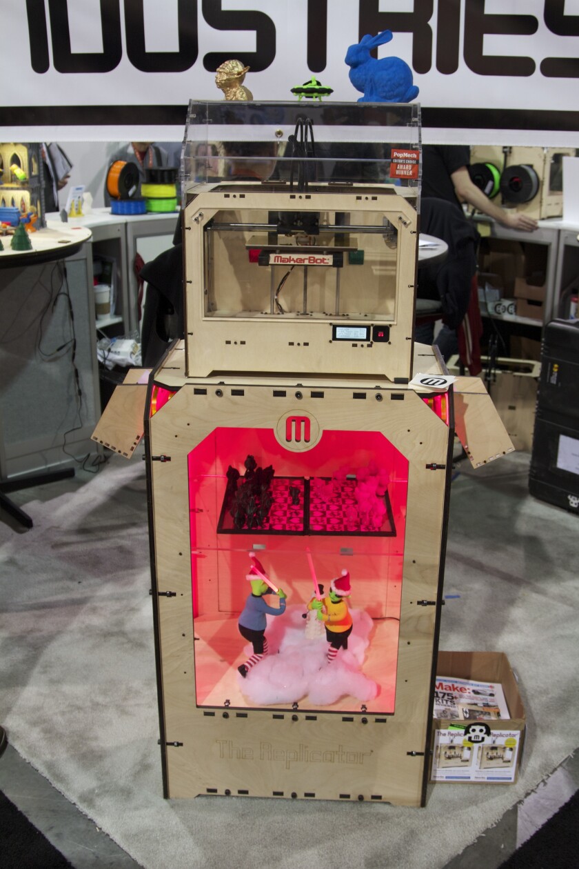 MakerBot's new Replicator 3D printer above, and a few of its printed objects above and below