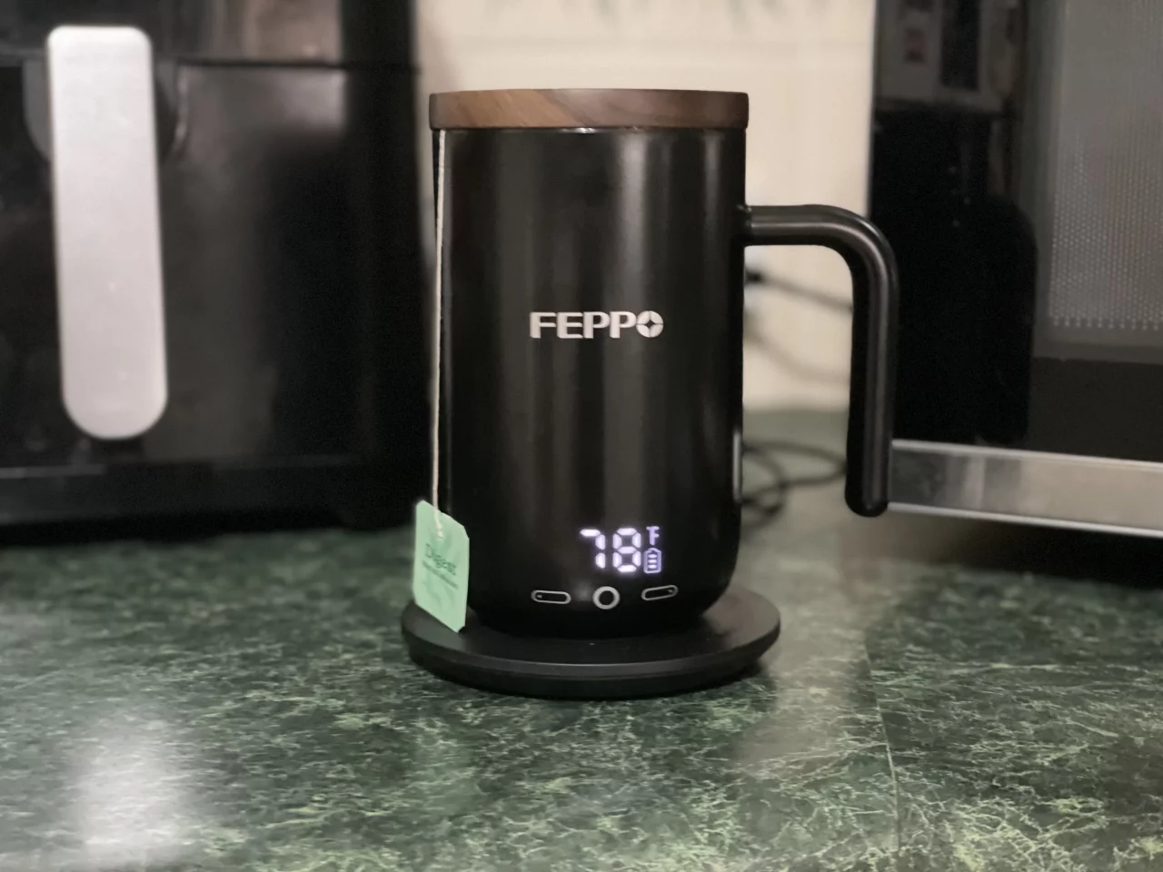 My tepid tea was placed back on the coaster for it to warm up again