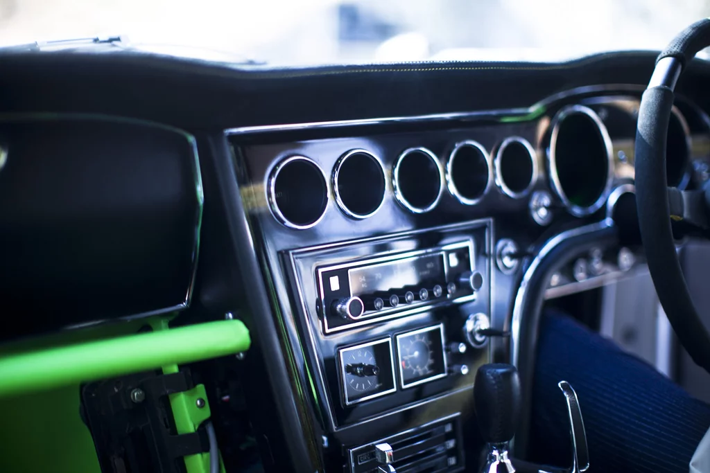 The Alcantara dash with gold and silver finish, and seven gloriously old school gauges to display speed, battery level and other information related to the running of the 2000GT SEV