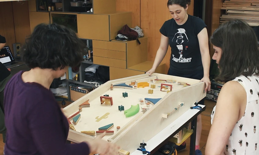 A delightfully low tech two-player pinball machine made by Cristiana Felgueiras