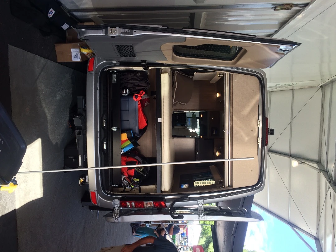 The Era 4x4's rear loading area includes a slide-out gear tray