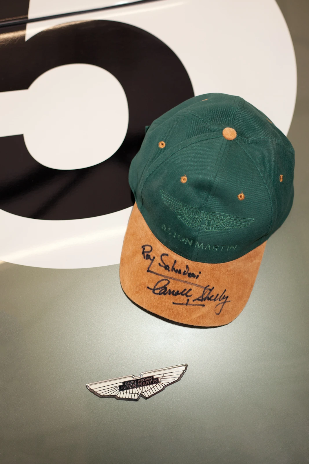 An Aston Martin cap, signed by both drivers Salvardori and Shelby to be included in the auction (Image: Richard Pardon)