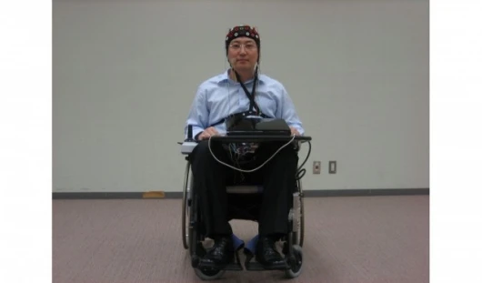 The Toyota/RIKEN wheelchair - this laboratory prototype runs with the EEG detector run by a laptop (Photo: RIKEN)