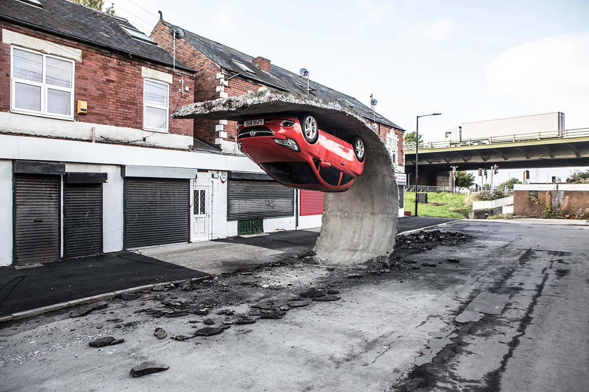 Pick yourself up and pull yourself together was a feat of structural engineering tearing up tarmac and supporting a car upside down