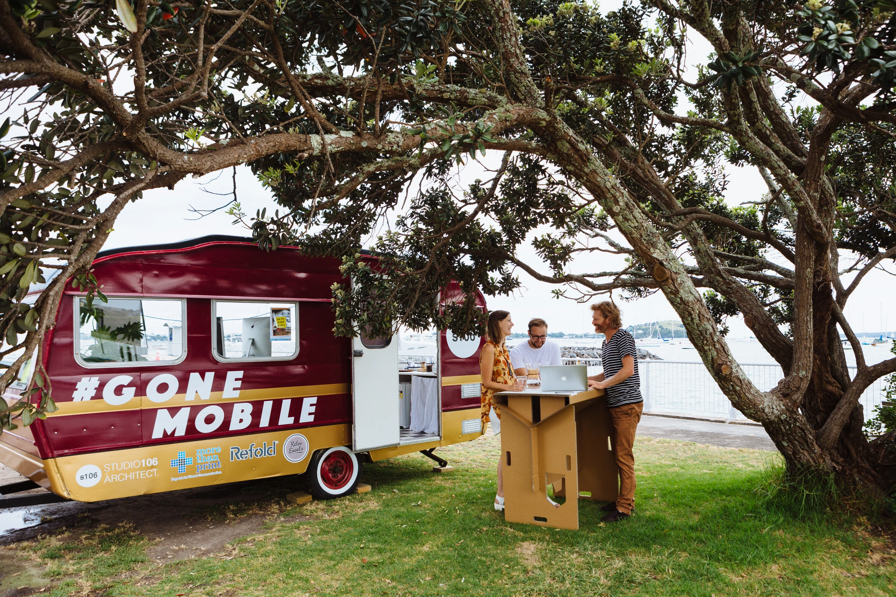 A flexible stand-up desk offers the possibility to work in the shade of a near by tree