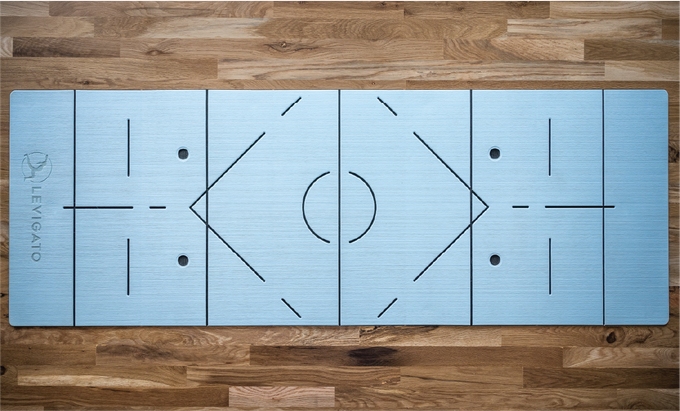One side of the Levigato fitness mat features alignment guides