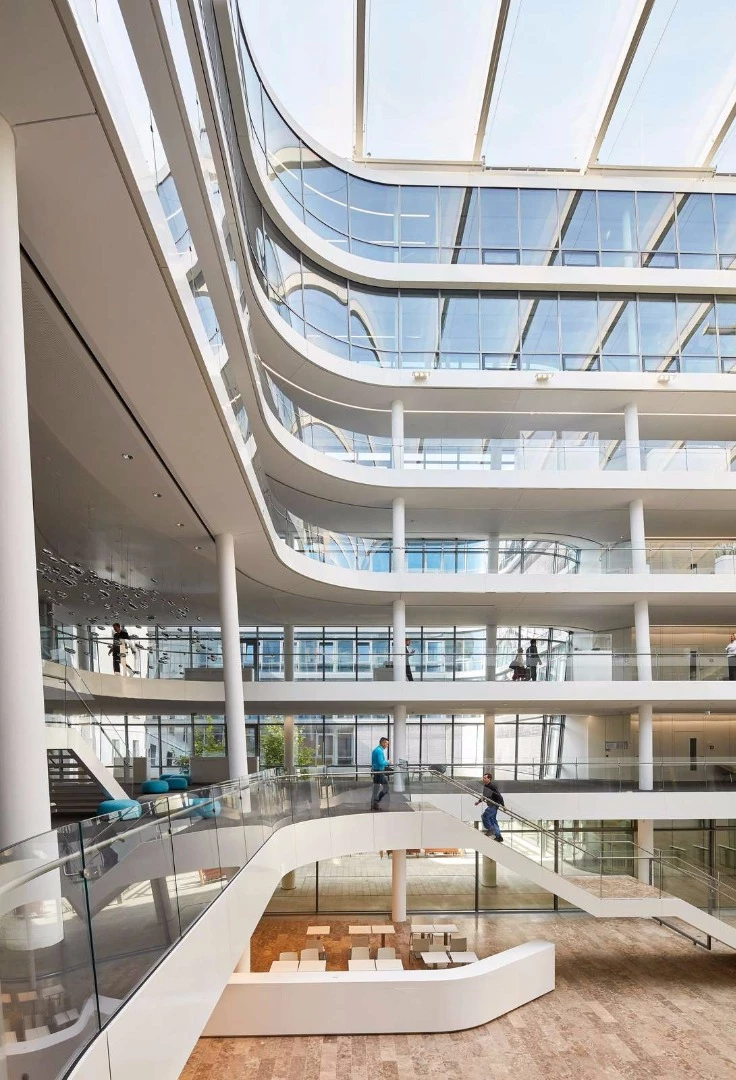 Large swathes of glass fill the atrium with natural light