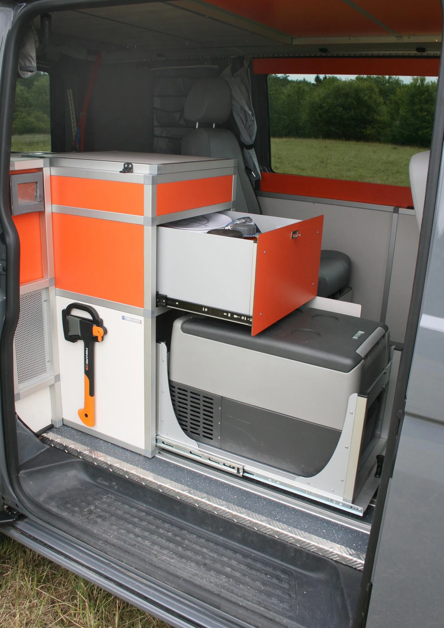 Slide-out compressor fridge ... plus a hatchet hung on for good measure