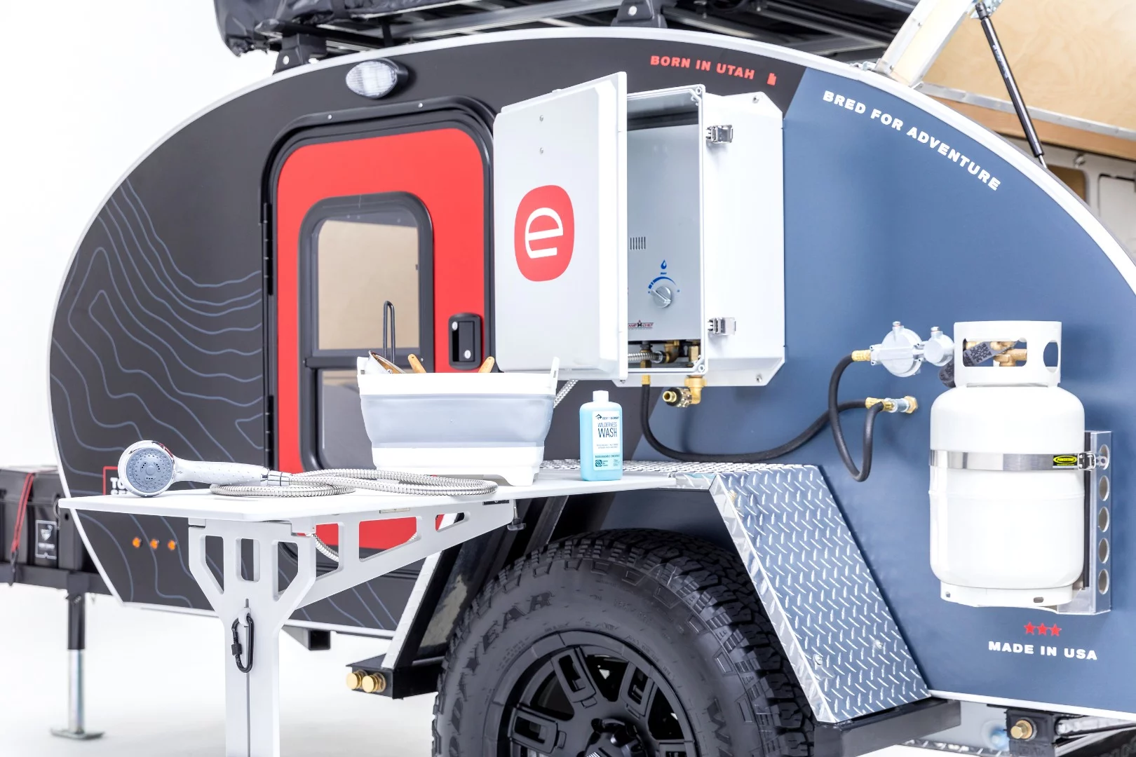We like the dishwashing layout with new table and optional water heater a little better than the simpler layout on our trailer