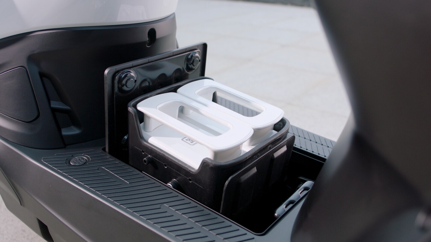 The smart battery bay of the 2018 KYMCO Ionex opens up automatically at the push of a button