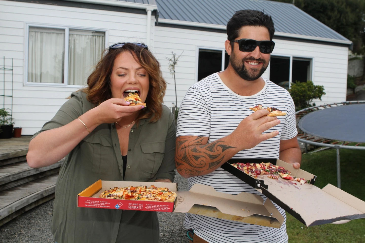 Customers tuck into their drone-delivered-pizza