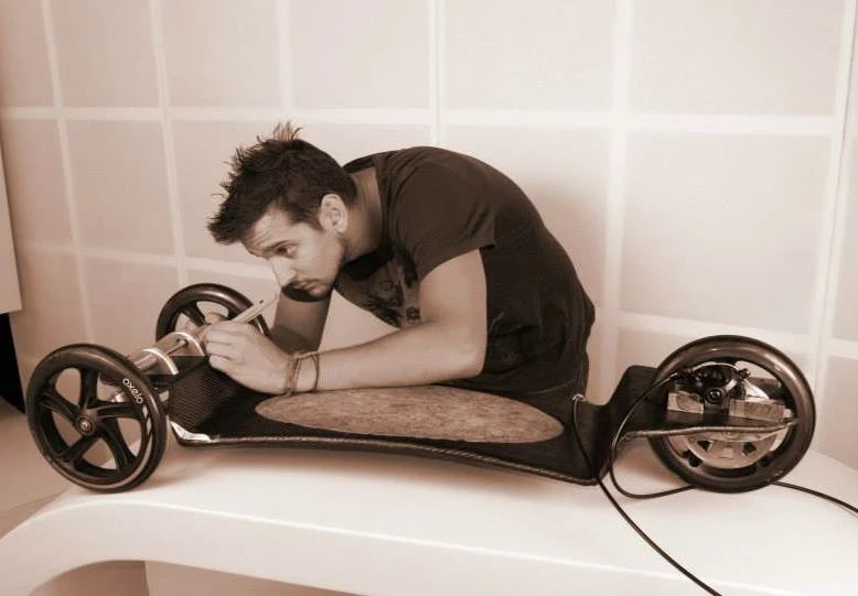 Designer Csaba Tolgyesy works on one of the prototypes