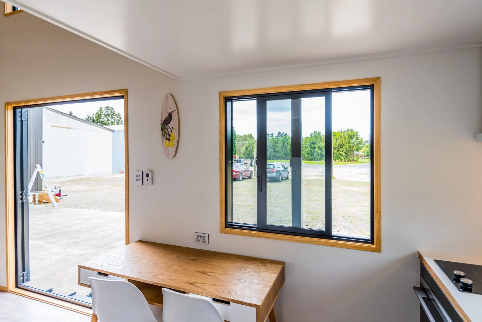 ThePohutukawa design includesan open living space with dining/office zone