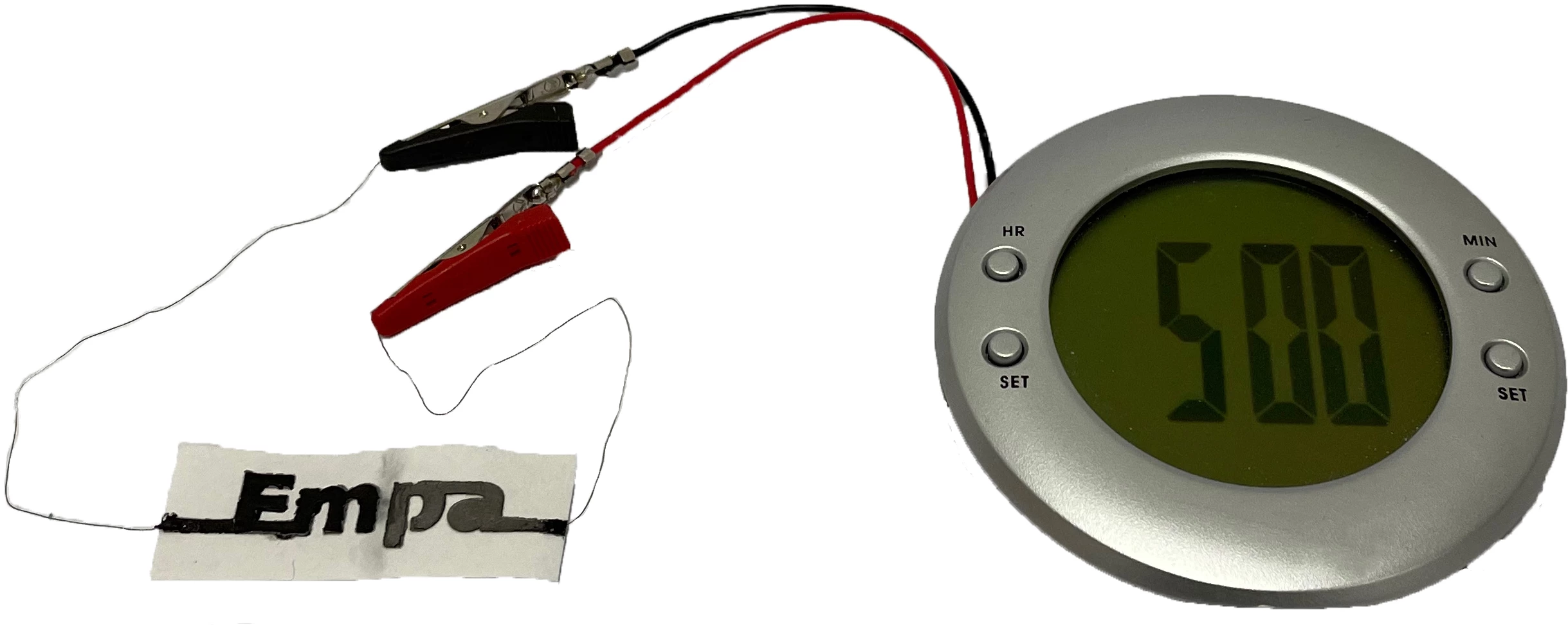 The scientists used a two-cell paper battery to power an LCD alarm clock