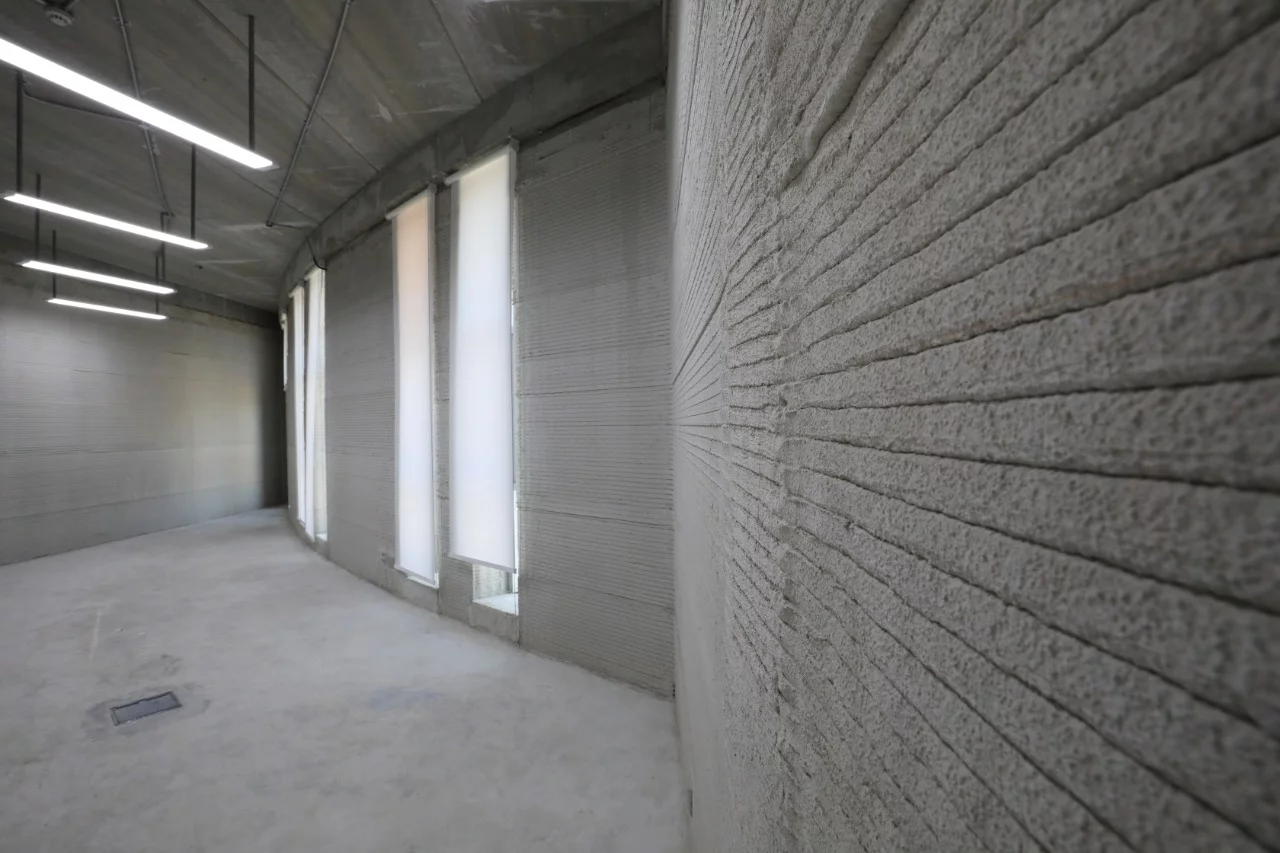 Construction involved a cement mixture being extruded through a nozzle in layers to build up the basic structure of the administrative building