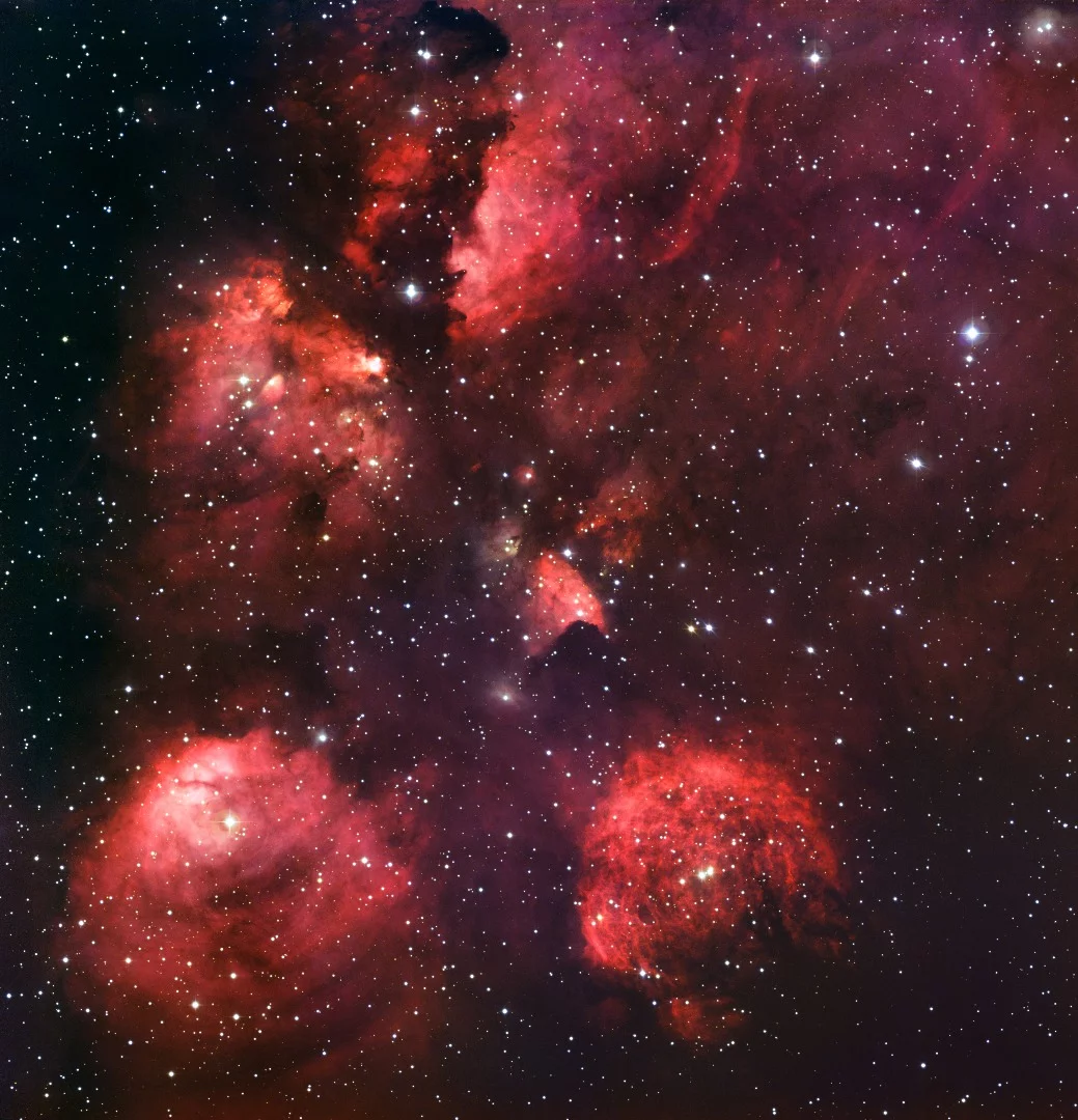A shot of the Cat's Paw Nebula as captured by the OmegaCam's predecessor the Wide Field Imager (WFI) in 2010. Installed aboard the 2.2-meter MPG/ESO telescope at the La Silla Observatory in Chile, WFI captured the image using special blue, green and red filters, as well as a special filter designed to detect the light of glowing hydrogen