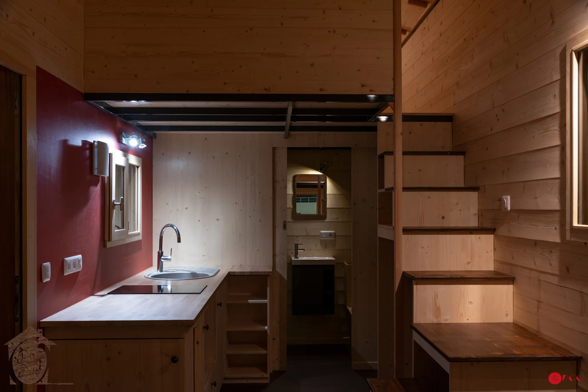A storage-integrated staircase leads up to the Axelle's main bedroom