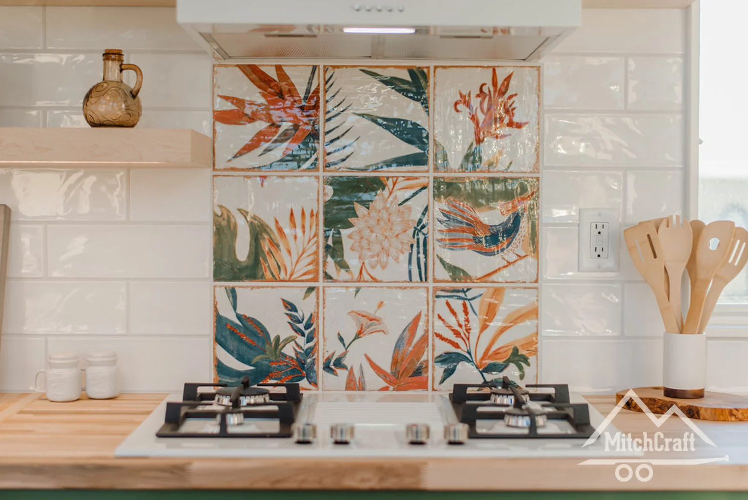 The kitchen boasts beautiful splash-back tiles