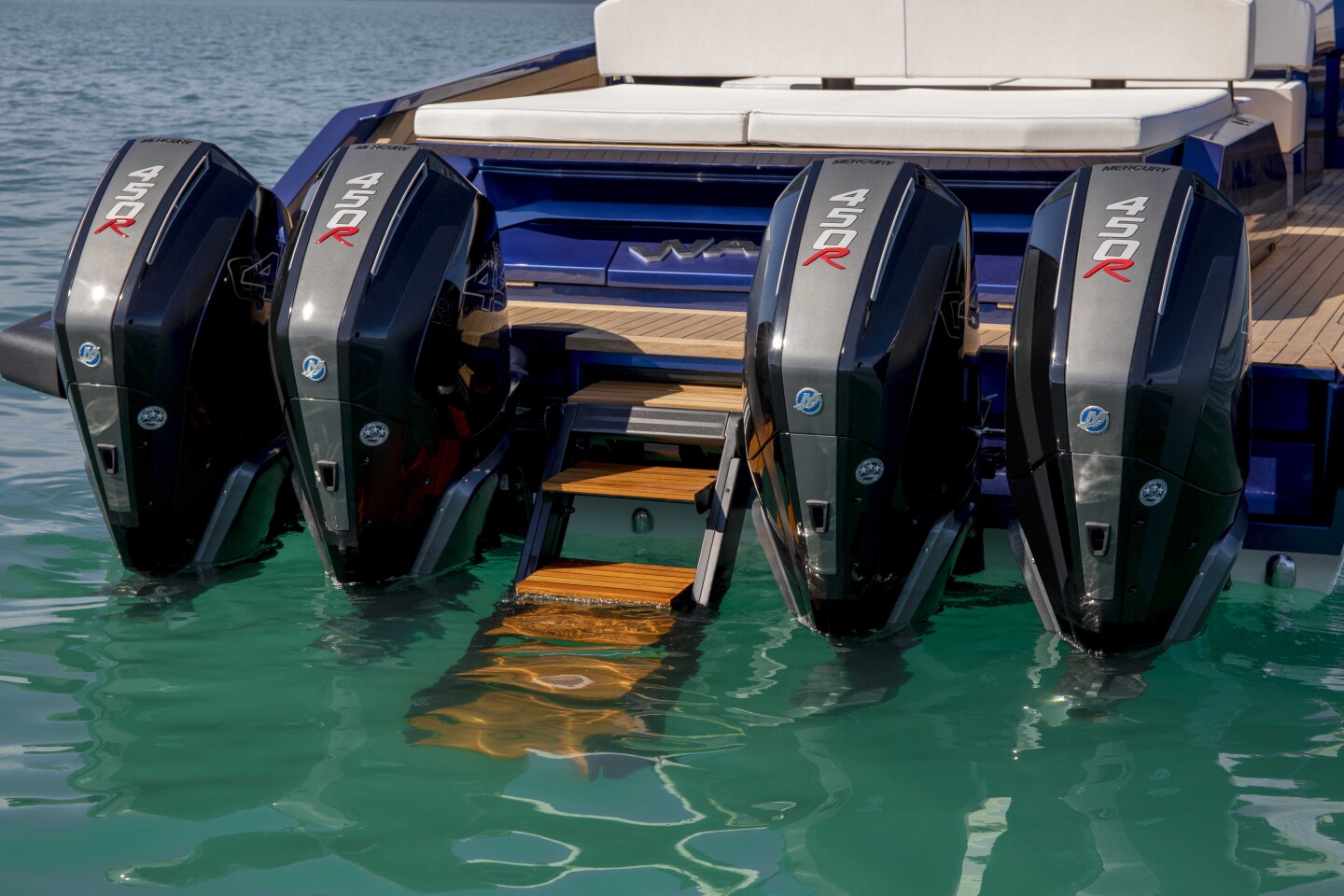 Wally splits apart the outboards to make way for the hydraulically operated swim ladder