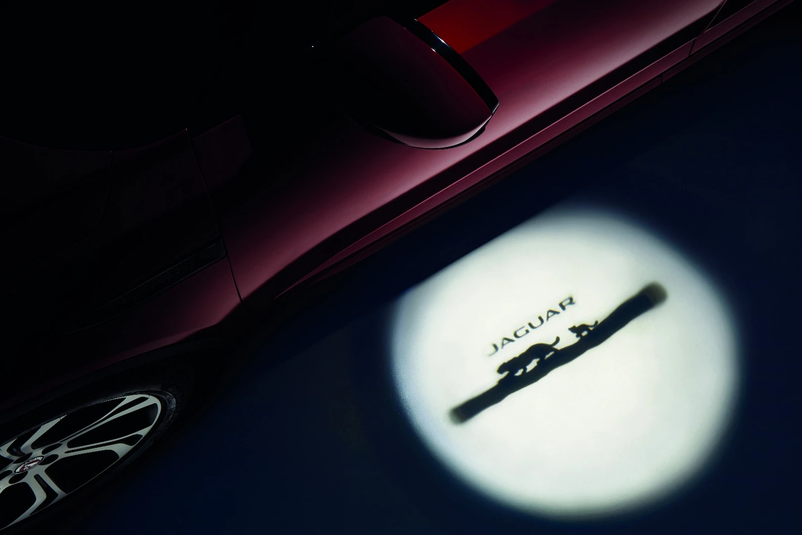 "A fun Jaguar Cub design in the obscuration band of the windshield and integrated into the puddle lamp projection have been incorporated solely to put a smile on customers’ faces," says Jaguar