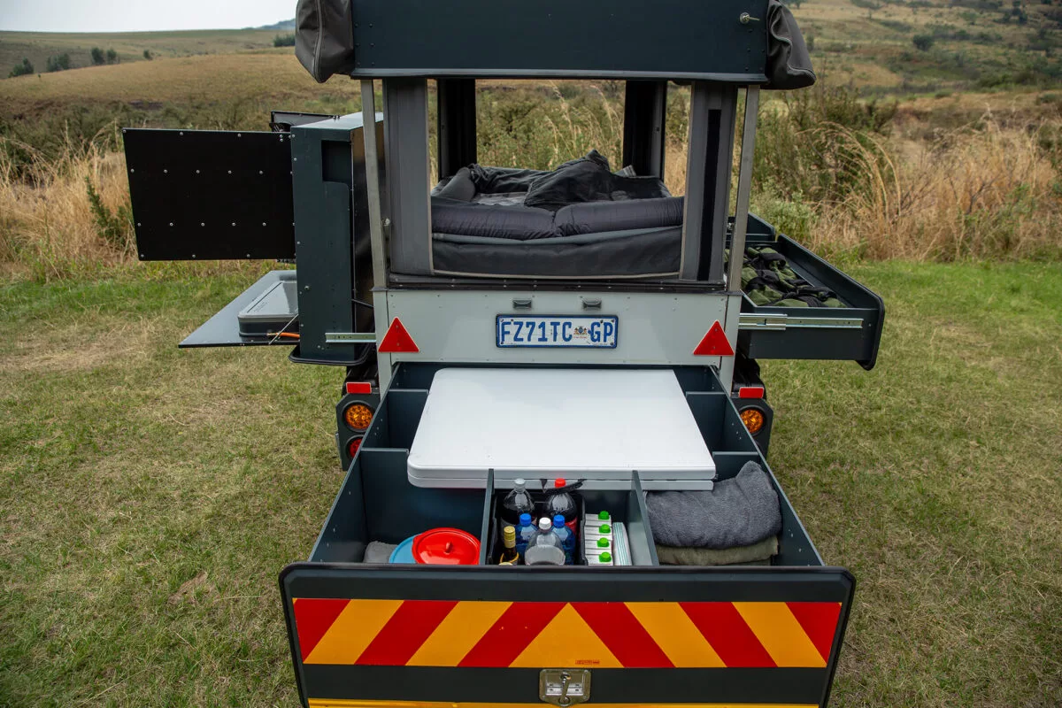 The large rear drawer holds a folding table with plenty of space to spare