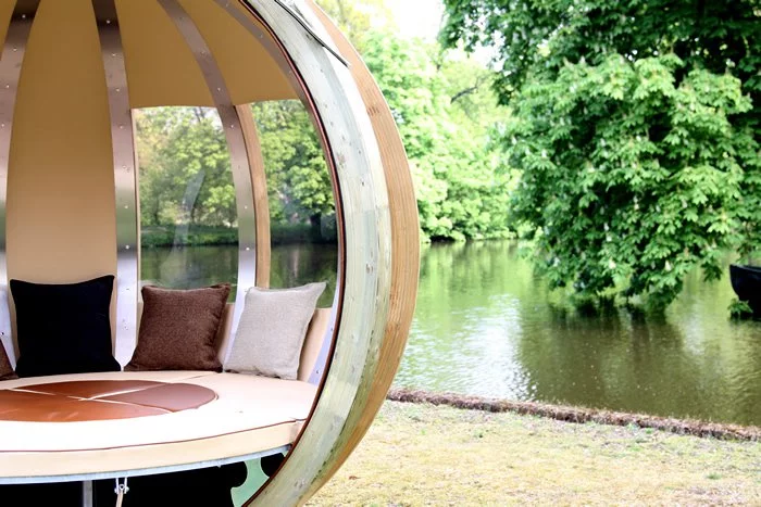 By lowering the table to seat height, an added cushion can slot into the opening, filling in the lounge circle to create a bed