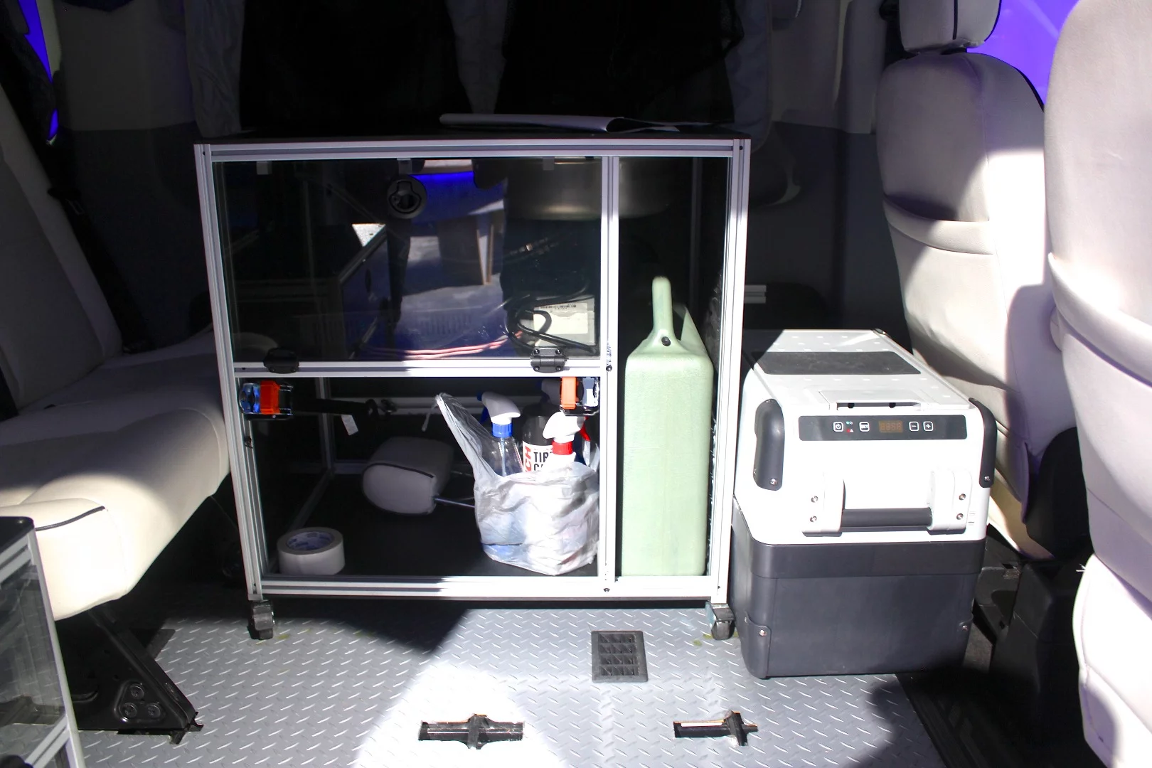 VanDoIt uses floor/wall/ceiling mounted T-track and camping/storage modules to create personalized adventure vans