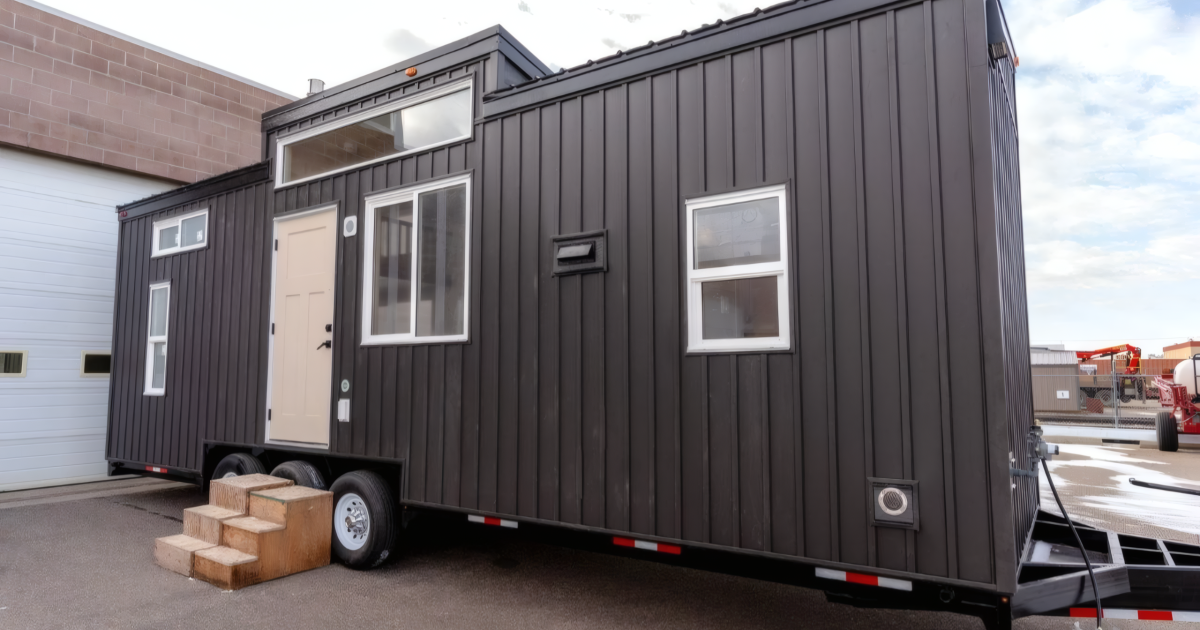 Family friendly tiny house fits two bedrooms in a towable frame