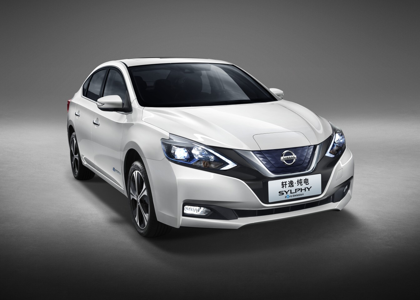 Like the Leaf, the Sylphy will charge from the front, with charge ports hidden under a hinged cover above the Nissan plate on the grille