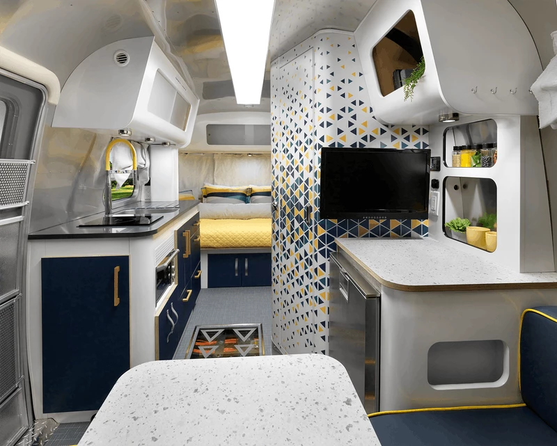 The eStream concept trailer features a rear sleeper/front dinette layout with technologies like voice control and power management