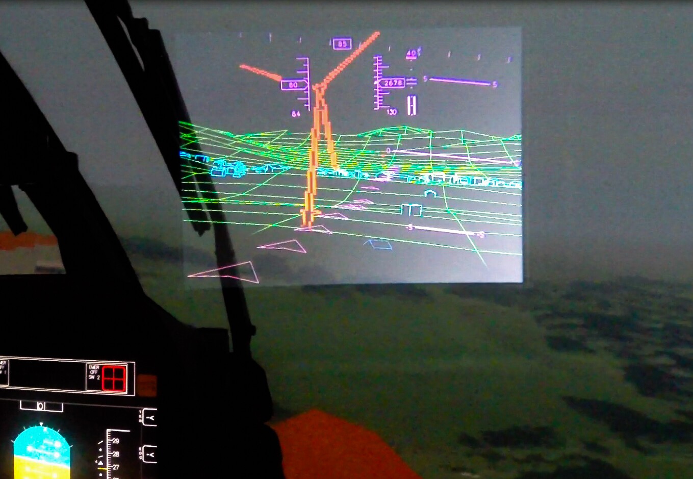 The LiDAR system renders tall thin structures like wind turbines and skyscrapers in red, and smaller structures and mountains in green