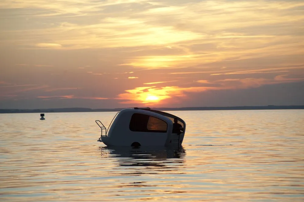 Sealander is a unique vehicle that combines features of an electric motor-powered boat and a camping trailer