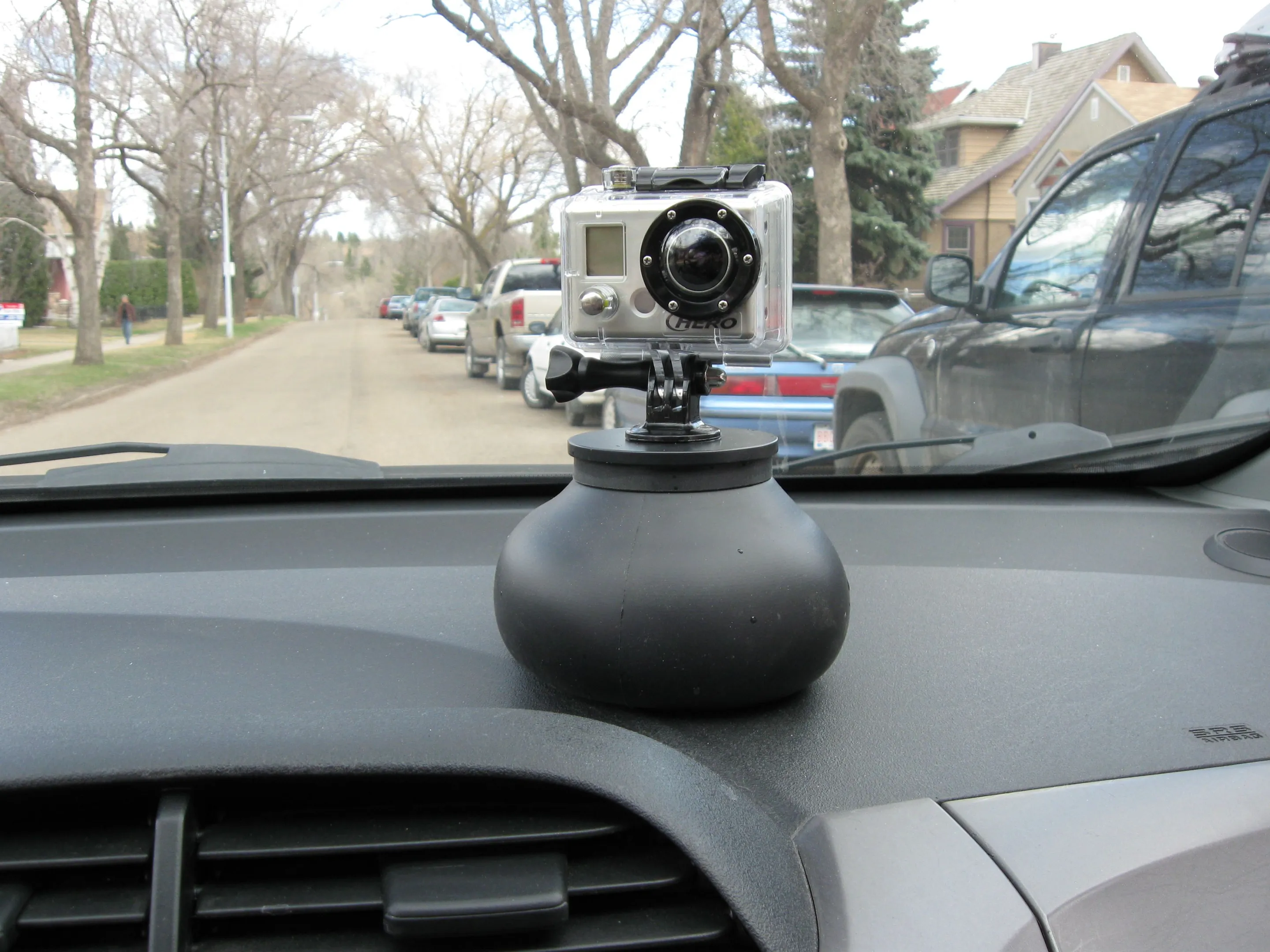 The Flex Shot's weight and wide rubber surface area allow it to grip a car's smooth plastic dashboard