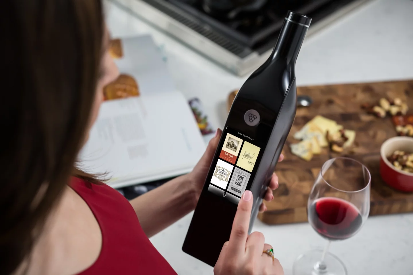 Kuvee's touchscreen shows the wine label by default, but also allows access to drinking tips, factoids, stories, wine recommendations, and one-touch ordering of wine