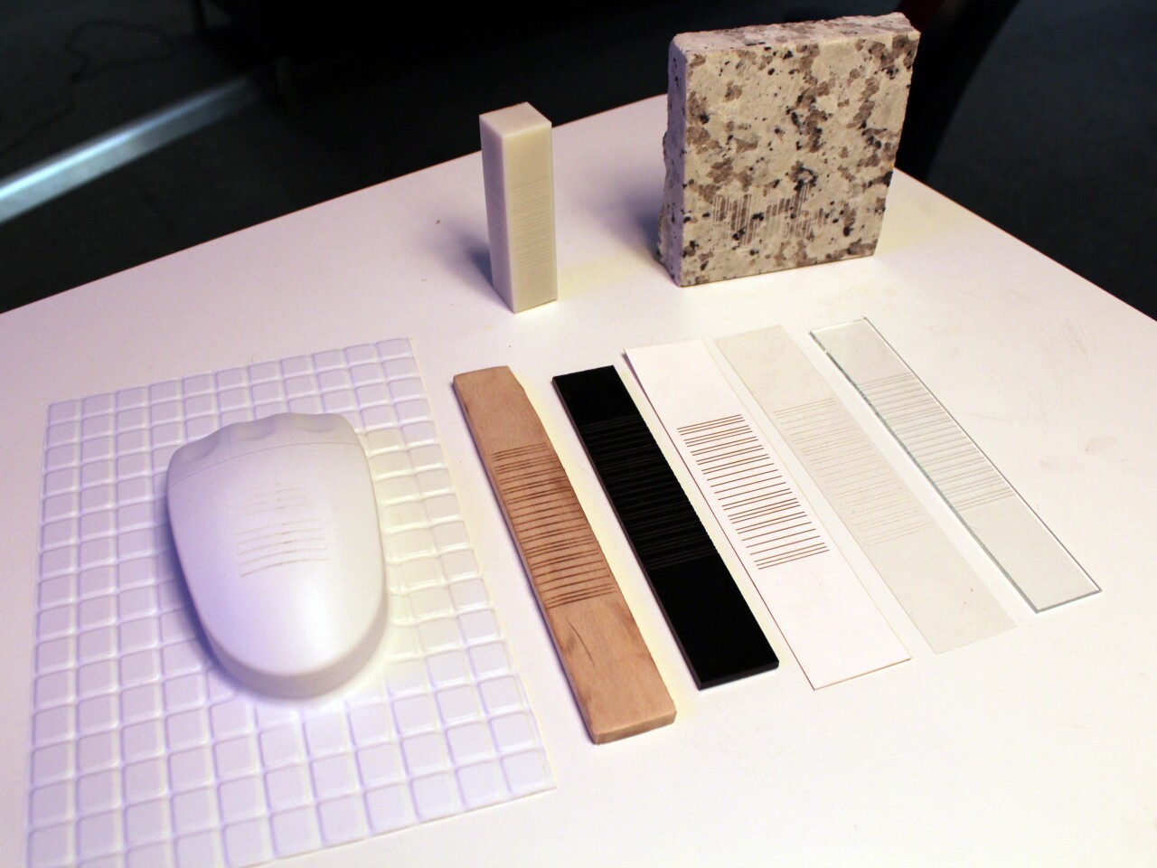 Acoustic barcodes can be incorporated into a variety of materials, including polystyrene (vacuum-formed), paper, transparency, wood, glass, acrylic, granite, and a 3D-printed object